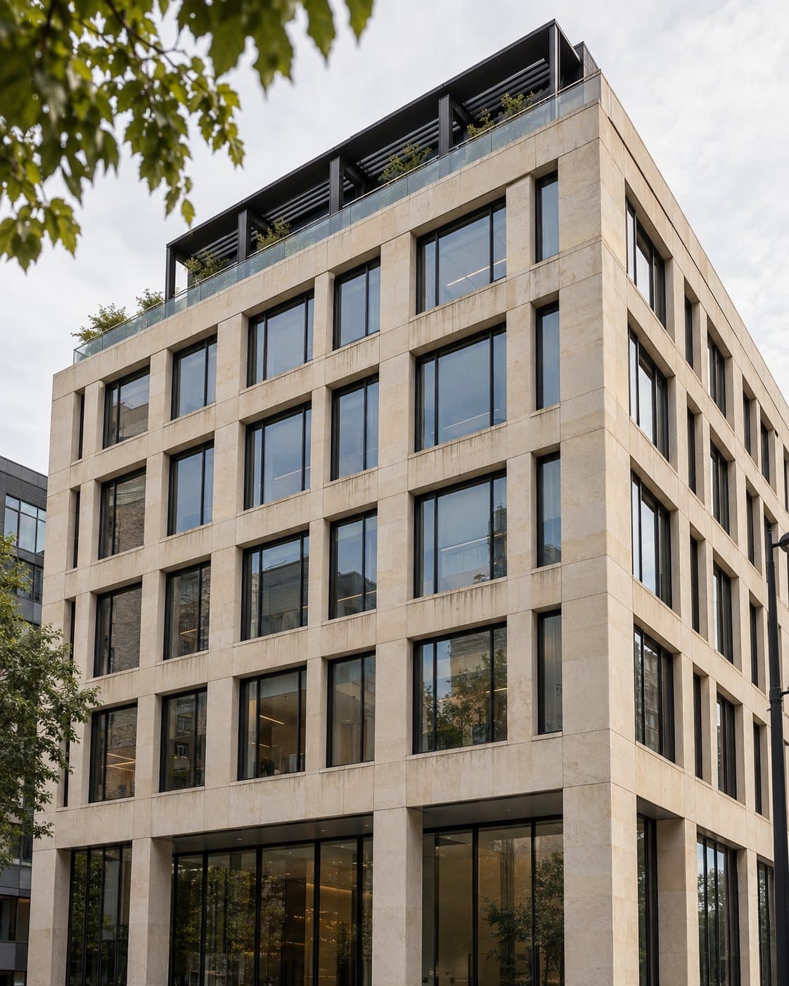 A six-story stone office building with black-framed windows